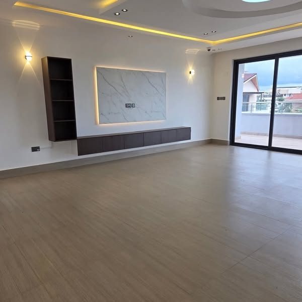 Tatu City — modern living room with marble media wall and balcony doors